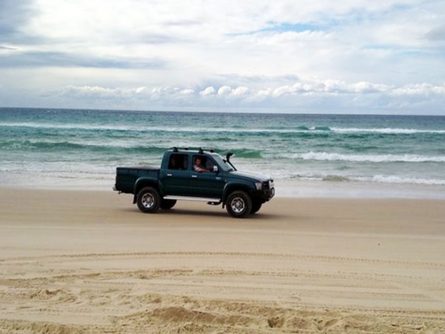 4WD Wheel Driving on the Beach, North Stradbroke Island, Qld Australia.Stay at Pats Retreat beach house accommodation.