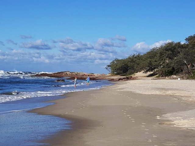 Surf fishing on Deadmans Beach, North Stradbroke Island, Queensland, Australia. Stay at Pats Retreat beach house accommodation.